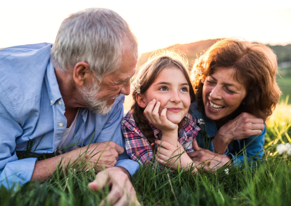 senior-couple-with-granddaughter-outside-in-TWEXCK4.jpg